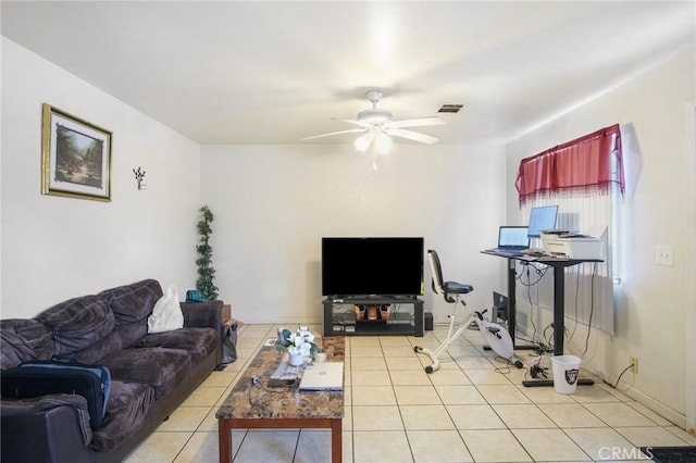 tiled living room with visible vents and a ceiling fan