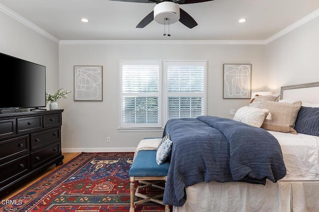 bedroom featuring ceiling fan, recessed lighting, wood finished floors, baseboards, and ornamental molding