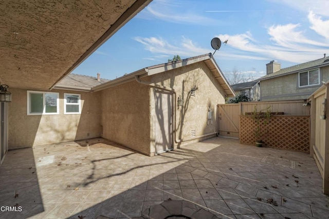 view of patio / terrace with a gate and fence