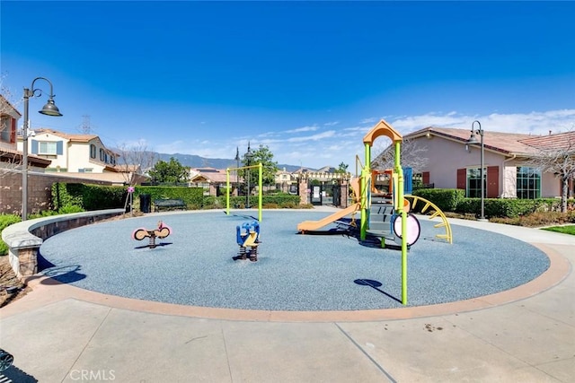 community jungle gym featuring a mountain view