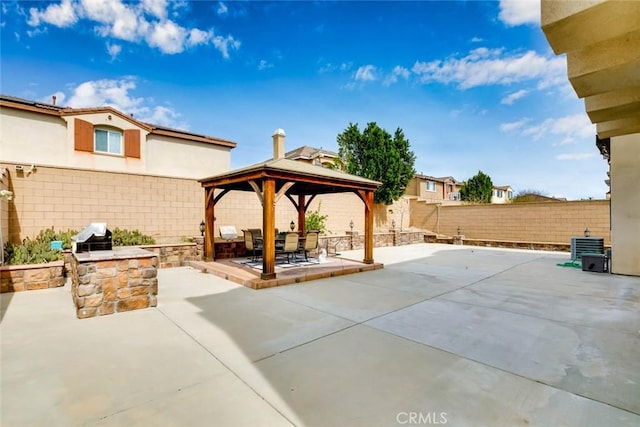 view of patio featuring a gazebo, central AC unit, and a fenced backyard