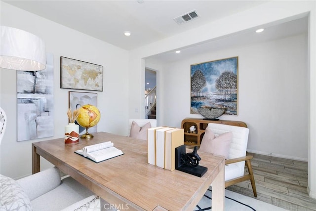 office space featuring baseboards, wood finished floors, visible vents, and recessed lighting