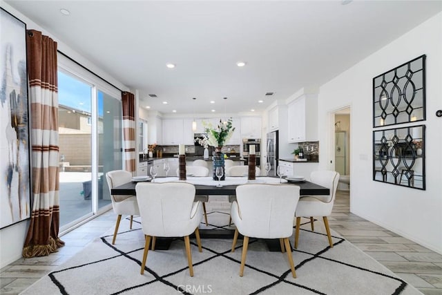 dining room with light wood-type flooring, visible vents, and recessed lighting