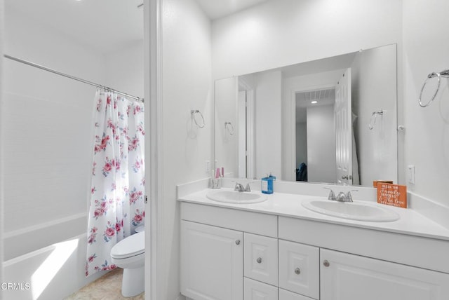 bathroom featuring shower / bath combo, a sink, toilet, and double vanity