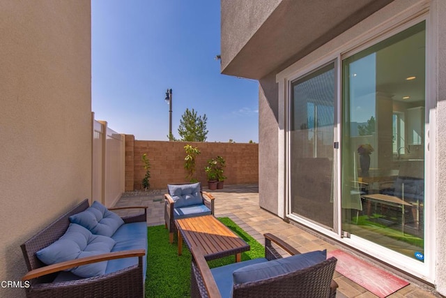 view of patio / terrace featuring a fenced backyard and an outdoor living space