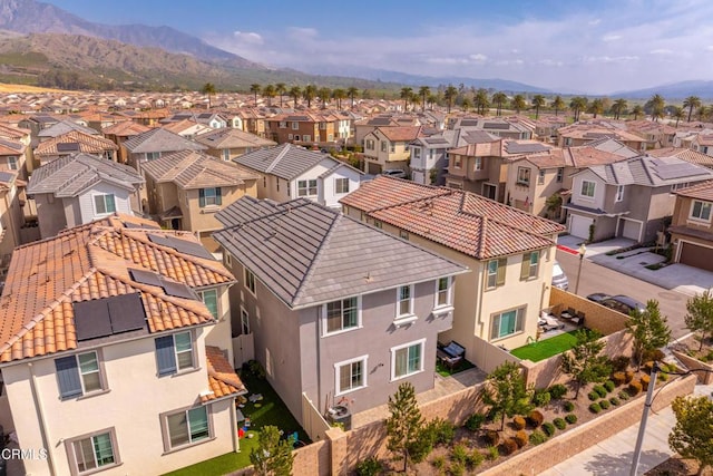 drone / aerial view with a residential view and a mountain view