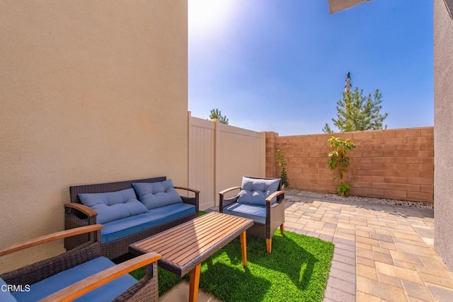 view of patio / terrace featuring a fenced backyard and an outdoor hangout area