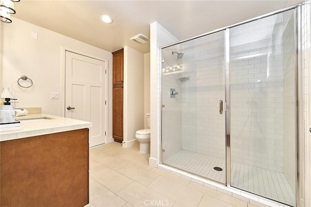 full bath featuring tile patterned flooring, toilet, visible vents, vanity, and a shower stall