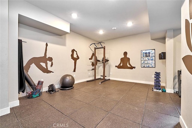 exercise area with baseboards and recessed lighting