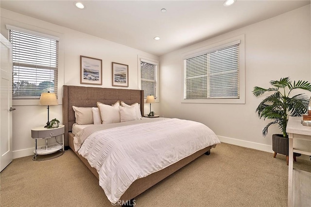 bedroom with recessed lighting, baseboards, and light colored carpet