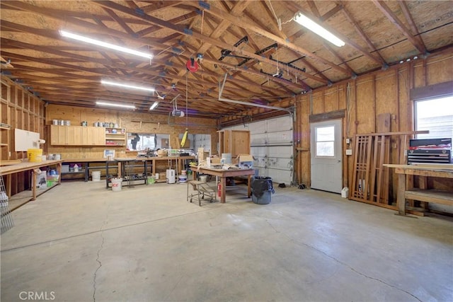 garage featuring a workshop area and a garage door opener