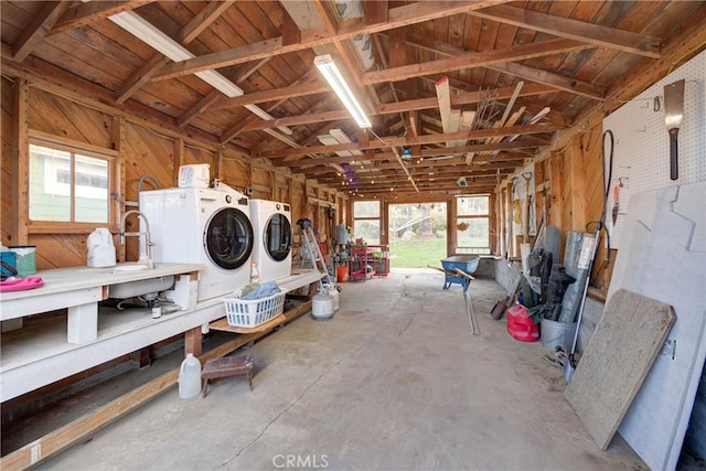 interior space featuring a workshop area and separate washer and dryer