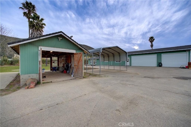 exterior space with a carport