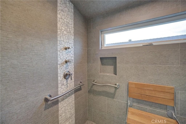 bathroom with tiled shower