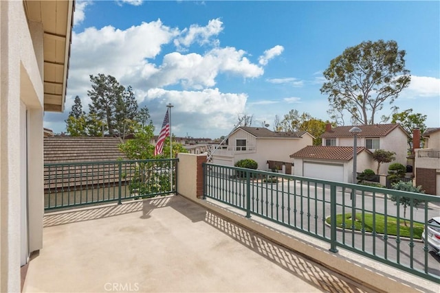 view of patio / terrace featuring a balcony and a residential view