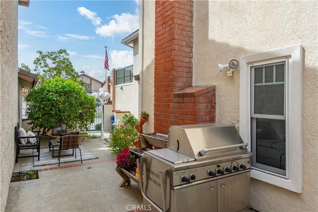 view of patio / terrace with a grill and area for grilling