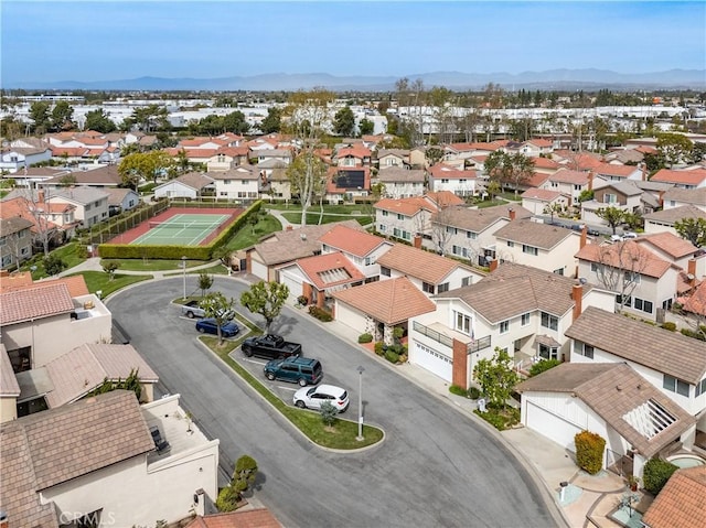 birds eye view of property with a mountain view and a residential view