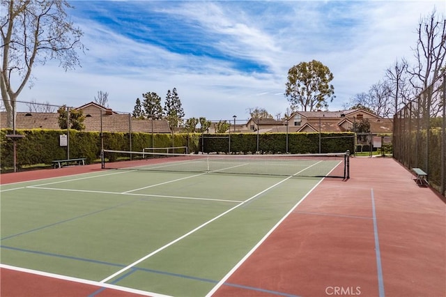 view of sport court featuring community basketball court and fence