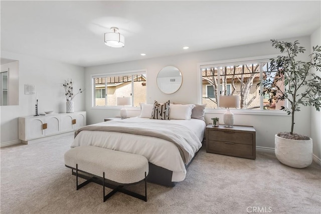 carpeted bedroom with baseboards and recessed lighting