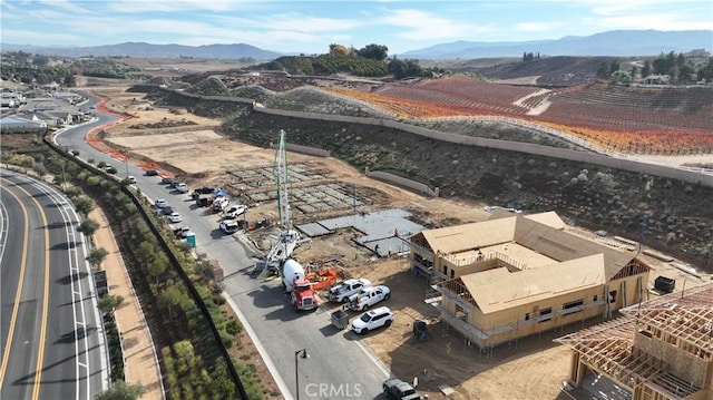 drone / aerial view featuring a mountain view