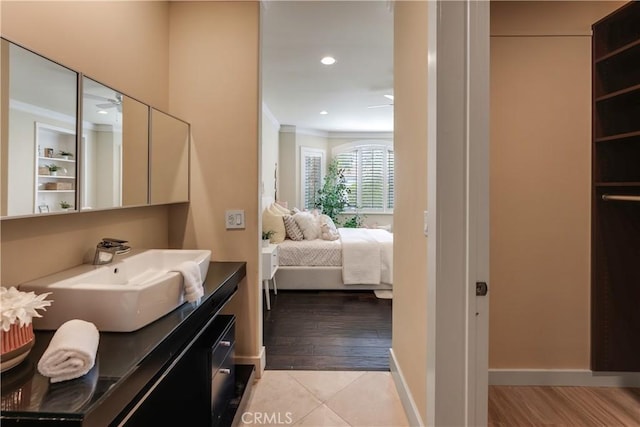 bathroom with recessed lighting, crown molding, ensuite bath, and wood finished floors