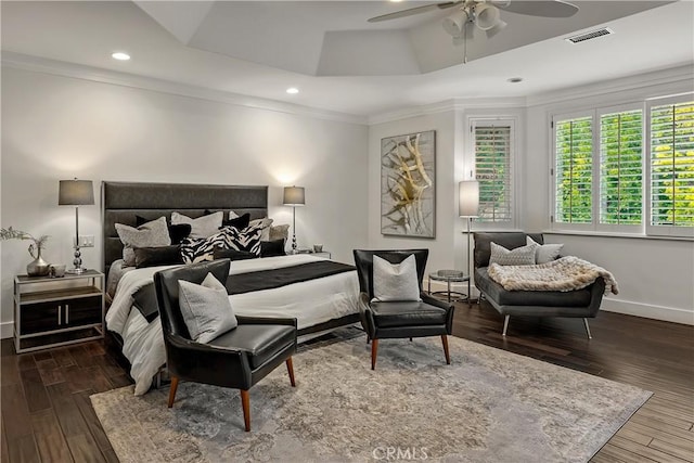 bedroom with baseboards, visible vents, recessed lighting, wood finished floors, and crown molding