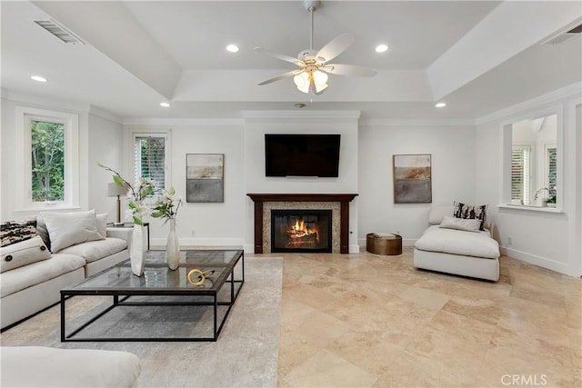 25605 Queenscliff Ct, Calabasas, CA 91302 - living area featuring ceiling fan, a raised ceiling, recessed lighting, a glass covered fireplace, and ornamental molding