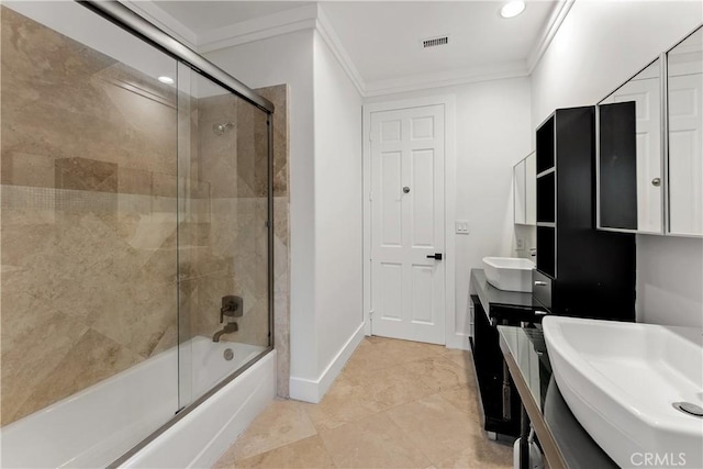 full bathroom with a sink, combined bath / shower with glass door, double vanity, ornamental molding, and visible vents