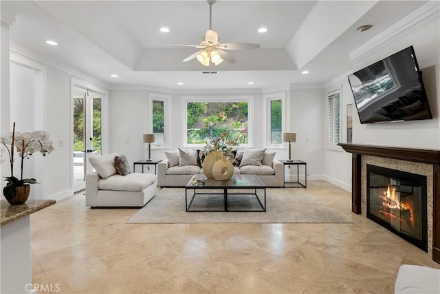 living area featuring ceiling fan, a healthy amount of sunlight, and recessed lighting