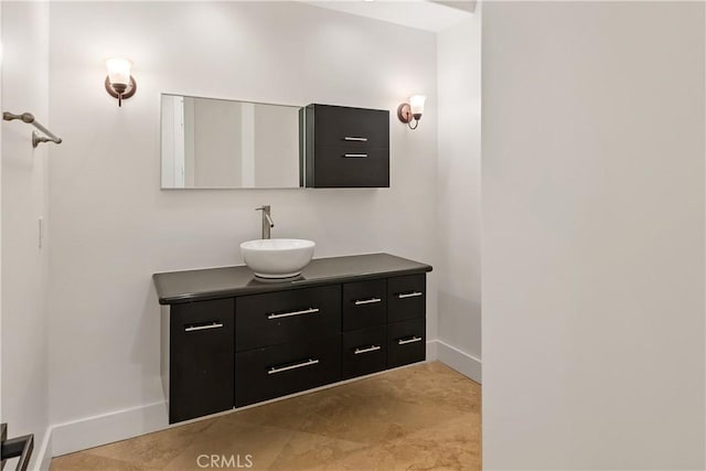 bathroom featuring vanity and baseboards