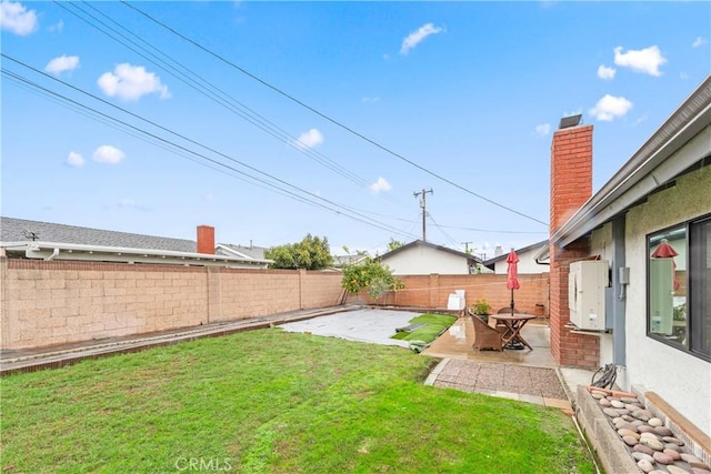 view of yard featuring a fenced backyard and a patio