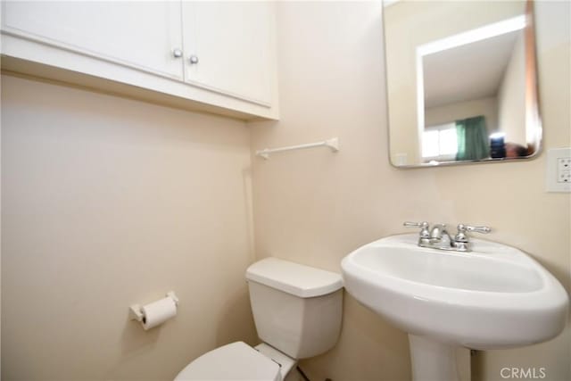 bathroom with a sink and toilet