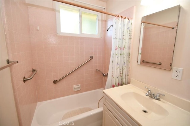 bathroom with shower / bath combo with shower curtain and vanity