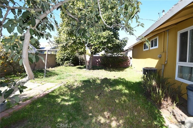 view of yard featuring a fenced backyard and central air condition unit