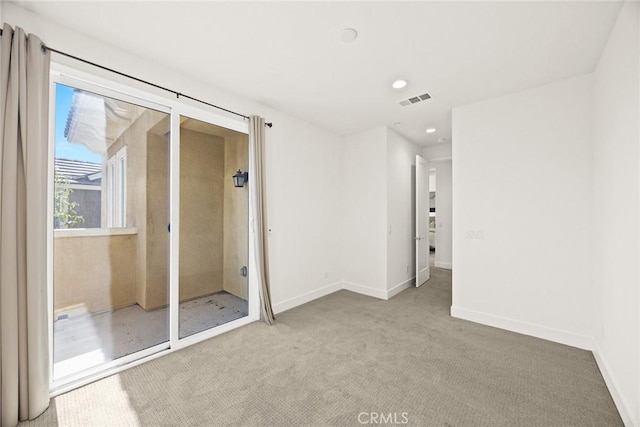 unfurnished bedroom with carpet floors, recessed lighting, visible vents, and baseboards