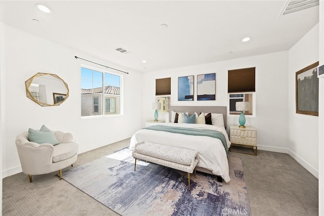 bedroom with baseboards, carpet floors, visible vents, and recessed lighting