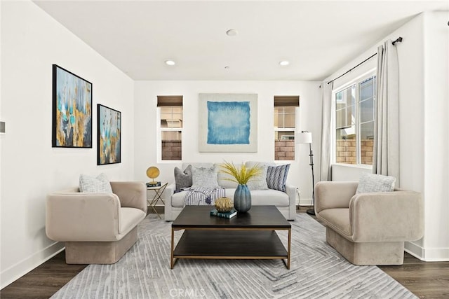 sitting room featuring recessed lighting, wood finished floors, and baseboards