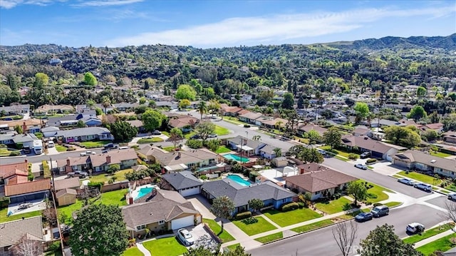 birds eye view of property with a residential view