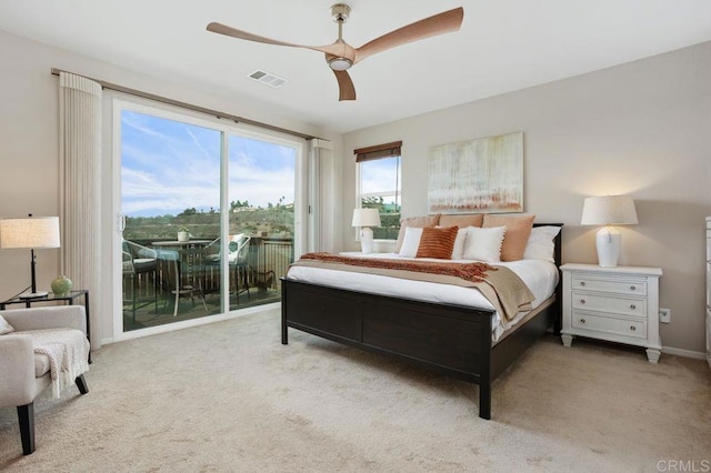 carpeted bedroom featuring a ceiling fan, access to outside, visible vents, and baseboards