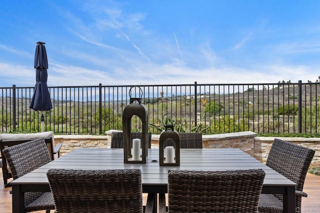 view of patio / terrace featuring outdoor dining area and fence