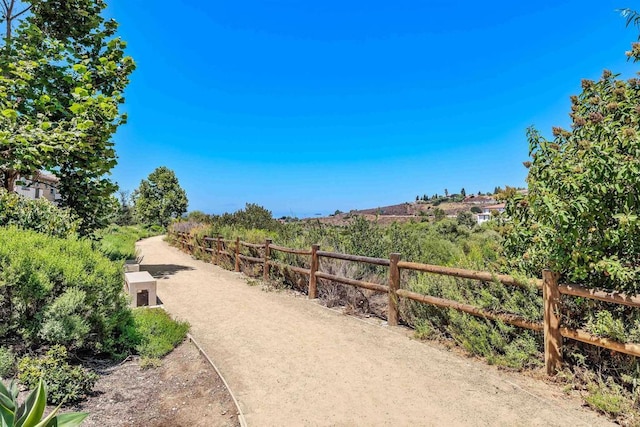 view of community with fence