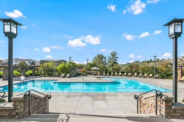 community pool featuring a patio area