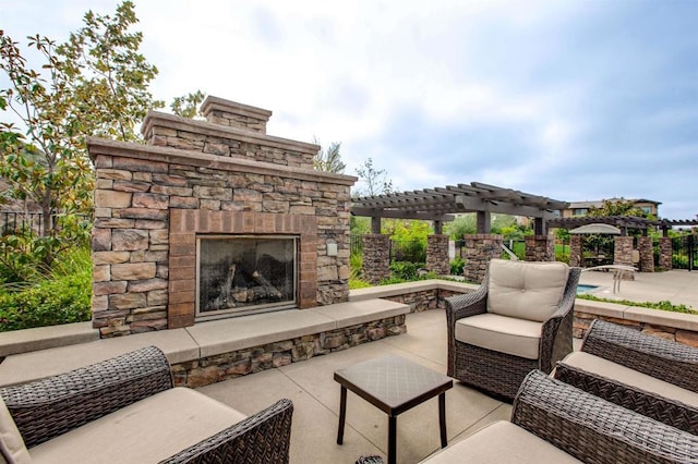 view of patio / terrace featuring an outdoor living space with a fireplace and a pergola