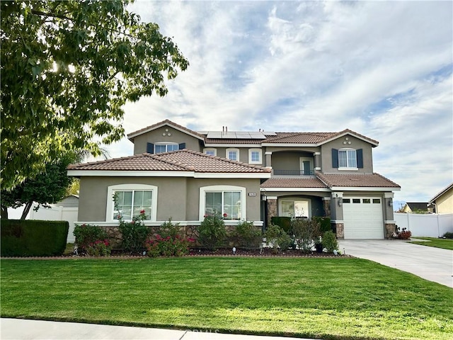 view of front of house featuring stone siding, concrete driveway, roof mounted solar panels, and a front yard