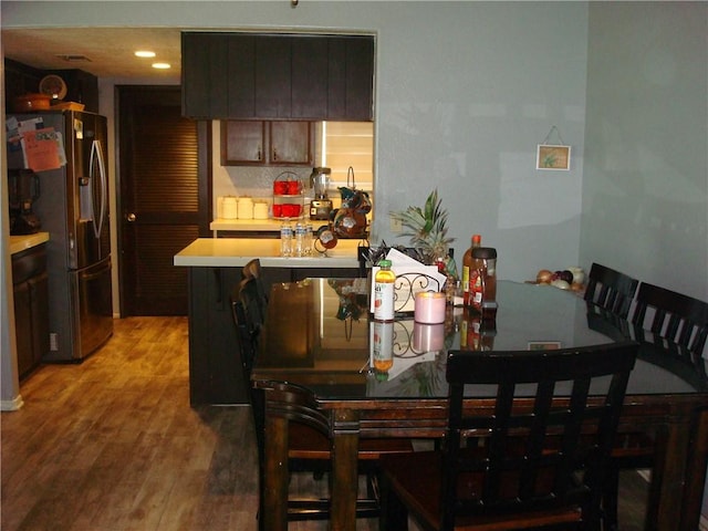 dining room featuring light wood-style floors and recessed lighting