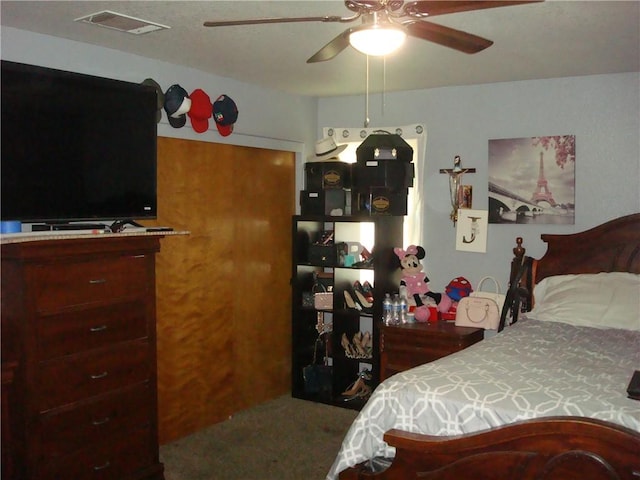 bedroom with ceiling fan and visible vents