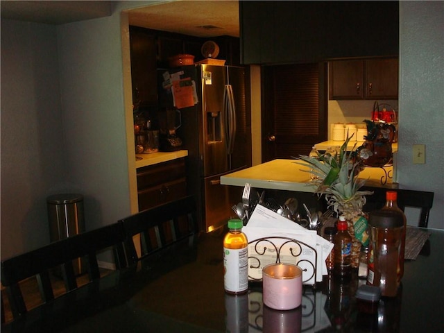 kitchen featuring stainless steel fridge