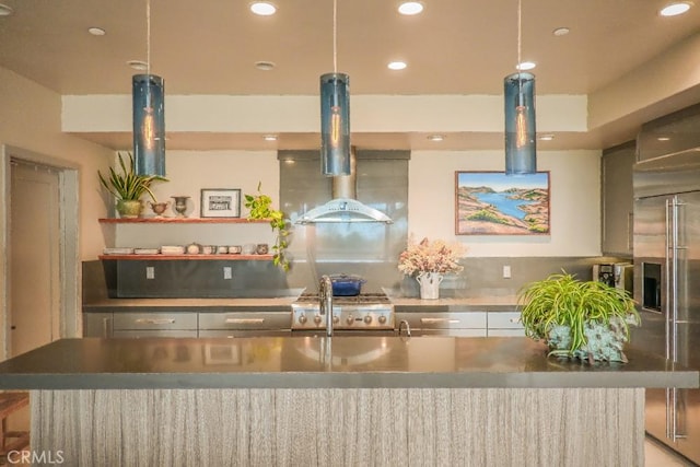 kitchen featuring recessed lighting, a spacious island, stove, stainless steel built in fridge, and island exhaust hood