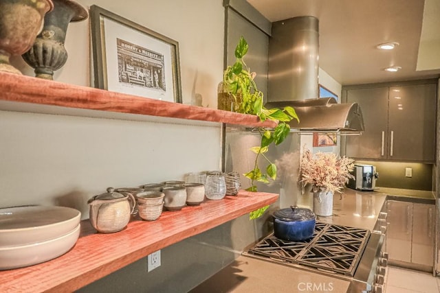 interior space featuring light tile patterned floors, butcher block counters, and recessed lighting