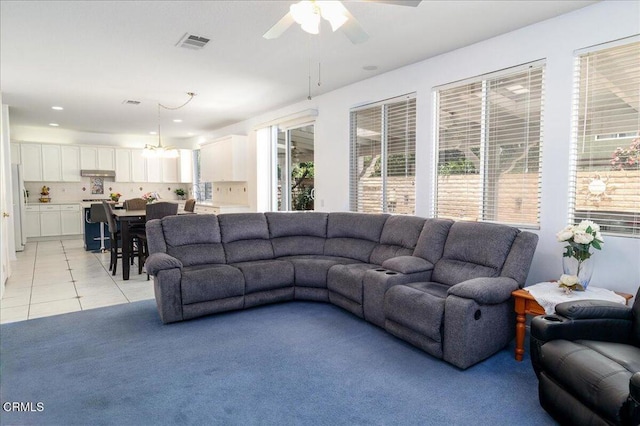 29065 Madrid Pl, Castaic, CA 91384 - living area with ceiling fan, light tile patterned floors, recessed lighting, and light carpet